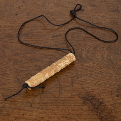 Lot 489 - Long nephrite jade bead in the form of a...