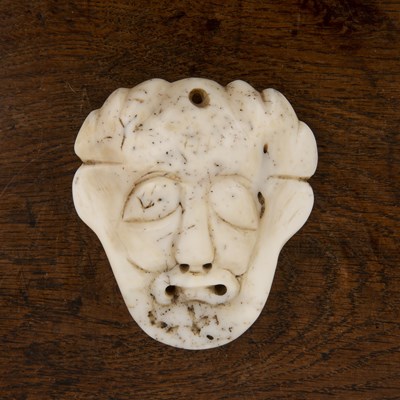 Lot 491 - Archaic nephrite jade crowned demon mask...