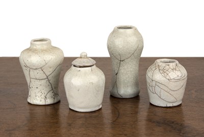 Lot 184 - Group of four Guan ware miniature vases/jars...