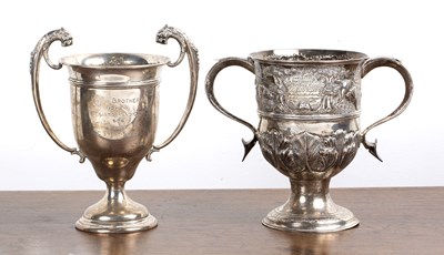 Lot 194 - Two silver trophy cups one with twin leopard...