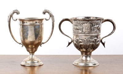 Lot 194 - Two silver trophy cups one with twin leopard...