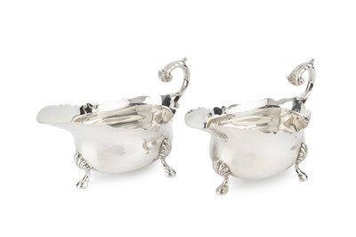 Lot 727 - A pair of George V silver sauce boats, with...