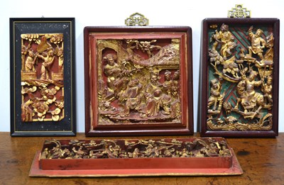 Lot 549 - Four giltwood and painted temple carvings...