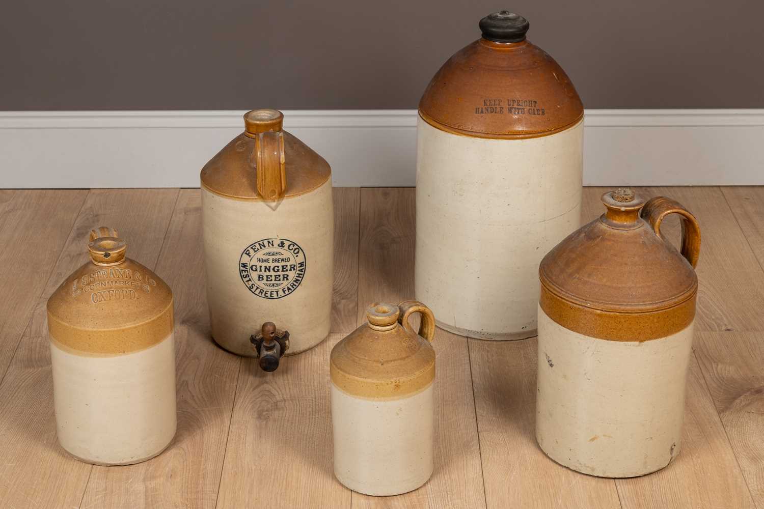 Lot 345 - Five 19th century stoneware flagons