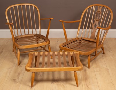 Lot 356 - Two 1960s Ercol hoop-back open armchairs with cushions seats; together with a stool