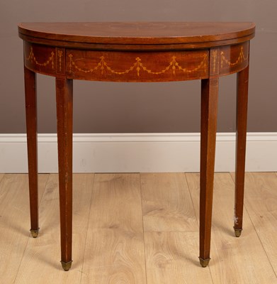 Lot 258 - An Edwardian mahogany demi lune card table