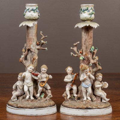 Lot 46 - A collection of porcelain to include a pair of figural candlesticks by Bohne Sohne