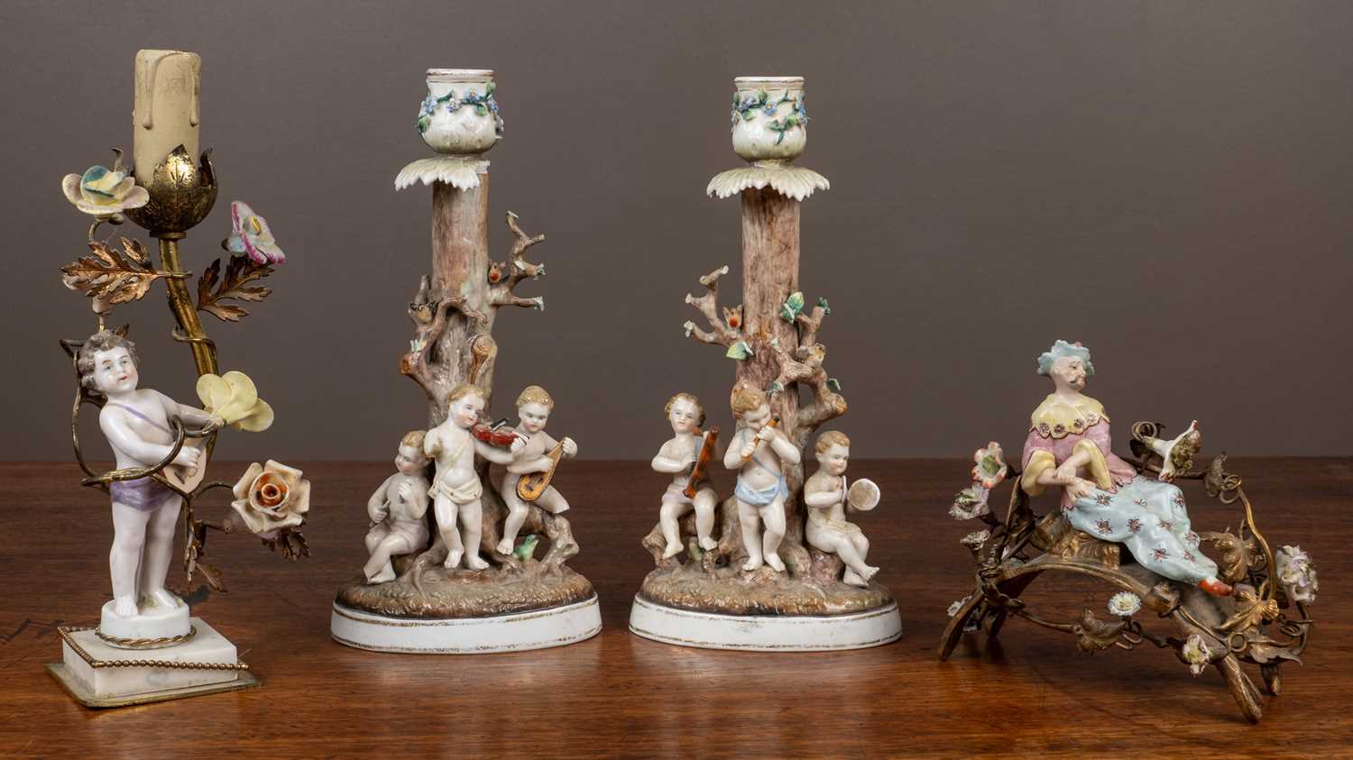 Lot 46 - A collection of porcelain to include a pair of figural candlesticks by Bohne Sohne