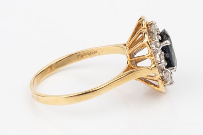 Lot 55 - A sapphire and diamond dress ring, the oval...