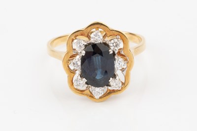 Lot 55 - A sapphire and diamond dress ring, the oval...