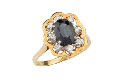 Lot 55 - A sapphire and diamond dress ring, the oval...