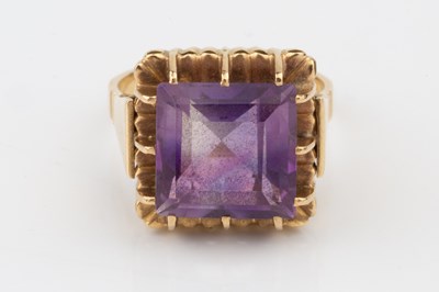 Lot 56 - An amethyst cocktail ring, the square cut...