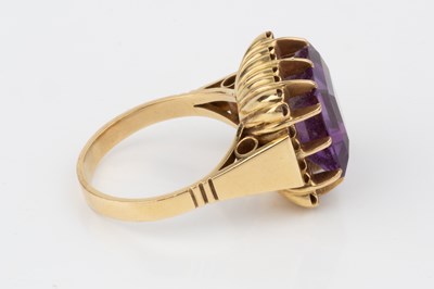 Lot 56 - An amethyst cocktail ring, the square cut...