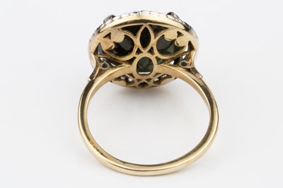 Lot 63 - A green stone and diamond set dress ring, the...