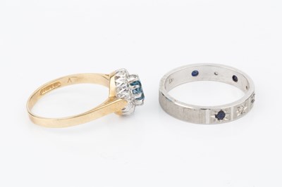 Lot 73 - An 18ct white gold, sapphire and diamond half...