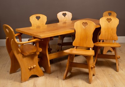 Lot 264 - A suite of elm dining furniture