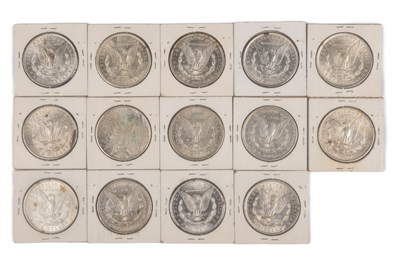Lot 40 - A collection of 14 American silver dollars