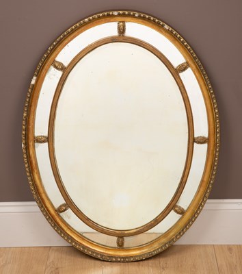 Lot 318 - A Regency style gilt oval wall mirror