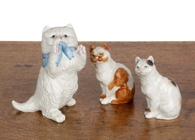 Lot 310 - Three Royal Worcester porcelain cats the...