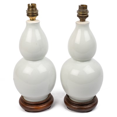 Lot 157 - A pair of white porcelain table lamps
