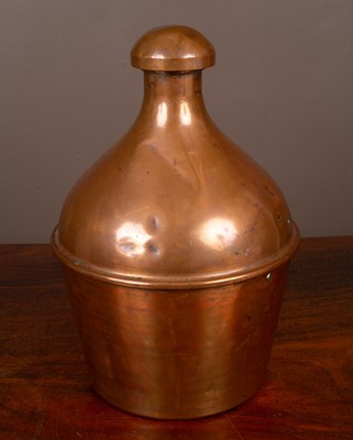 Lot 399 - A large copper bottle