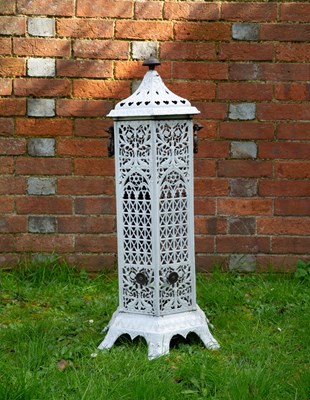 Lot 1212 - A cast iron enamelled conservatory heater