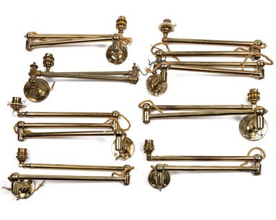 Lot 386 - A collection of brass articulated wall lights