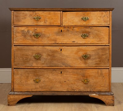 Lot 1073 - A Georgian elm chest of drawers