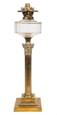 Lot 411 - A brass oil lamp modelled as a Corinthian column.