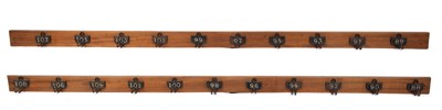 Lot 476 - A set of twenty-one numbered coat hooks