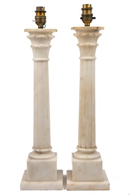 Lot 300 - A pair of alabaster table lamps