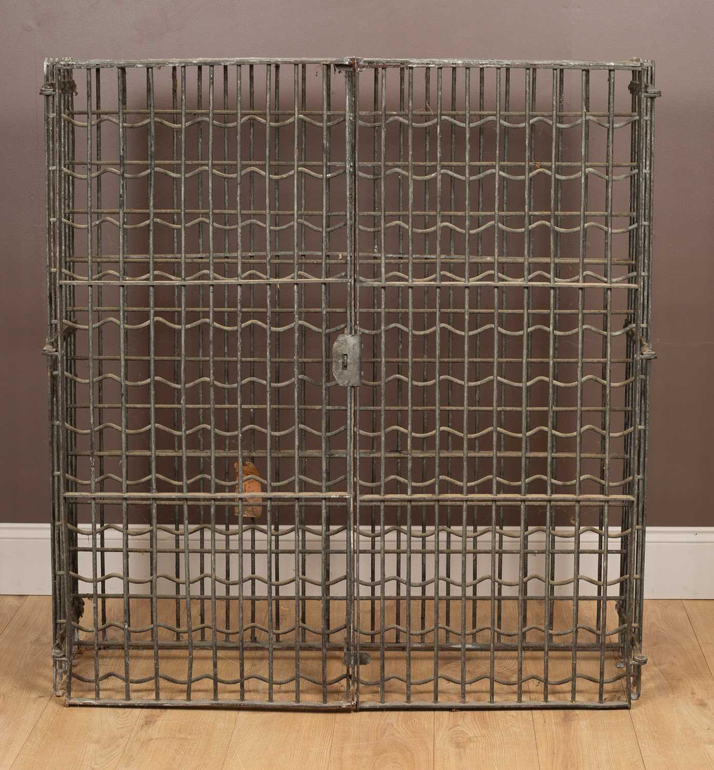 Lot 1179 - A galvanised iron lockable wine rack for 144 bottles