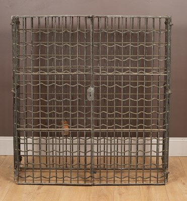 Lot 1179 - A galvanised iron lockable wine rack for 144 bottles