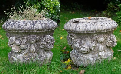 Lot 1213 - A pair of cast reconstituted stone planters or urn tops