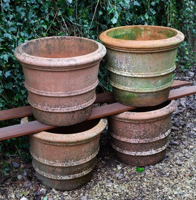 Lot 1312 - A set of four terracotta planters