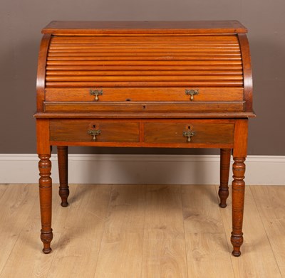 Lot 357 - A Victorian walnut rolltop desk