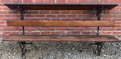 Lot 335 - An old wrought iron and oak church bench