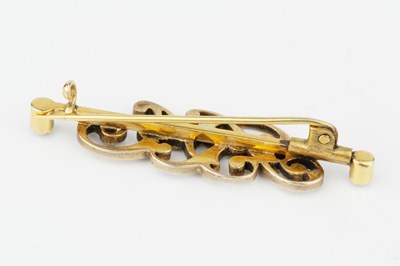 Lot 82 - A diamond set initial bar brooch, modelled as...