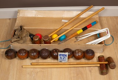 Lot 416 - A Townsend Croquet Ltd croquet set together with a set of eight wooden lawn bowls