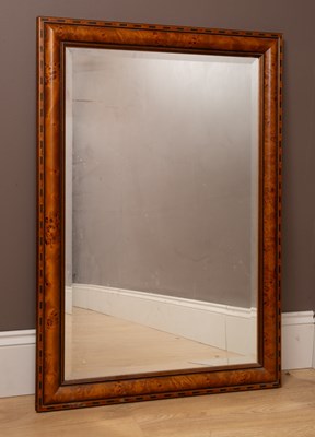 Lot 449 - A walnut veneer framed wall mirror