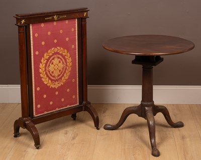 Lot 486 - A Georgian mahogany tilt-top occasional table together with an Empire style adjustable firescreen