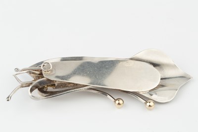 Lot 90 - A silver and gold heightened pendant by Graham...
