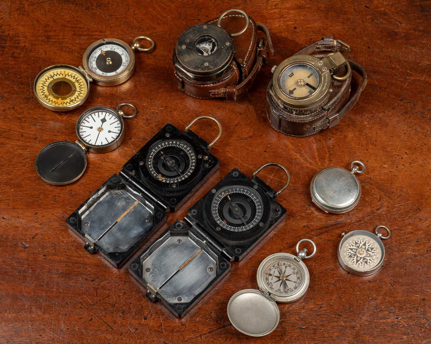 Lot 11 - A collection of military compasses