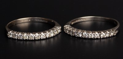 Lot 26 - A pair of diamond half hoop rings