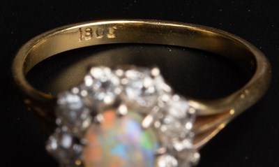 Lot 25 - An opal and diamond cluster ring