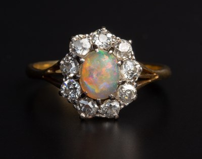 Lot 25 - An opal and diamond cluster ring