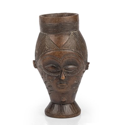 Lot 96 - A west African Kuba carved hardwood wine cup...