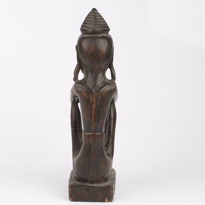 Lot 348 - An antique carved wood tribal seated figure...