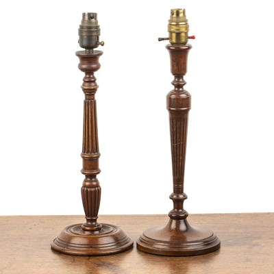 Lot 68 - Two similar wooden table lamps 20th Century,...