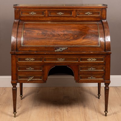 Lot 512 - A 19th century walnut roll-top desk